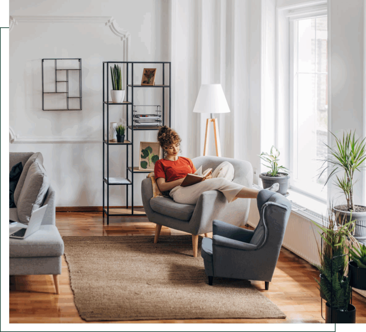 Woman reading in cozy, modern living room.
